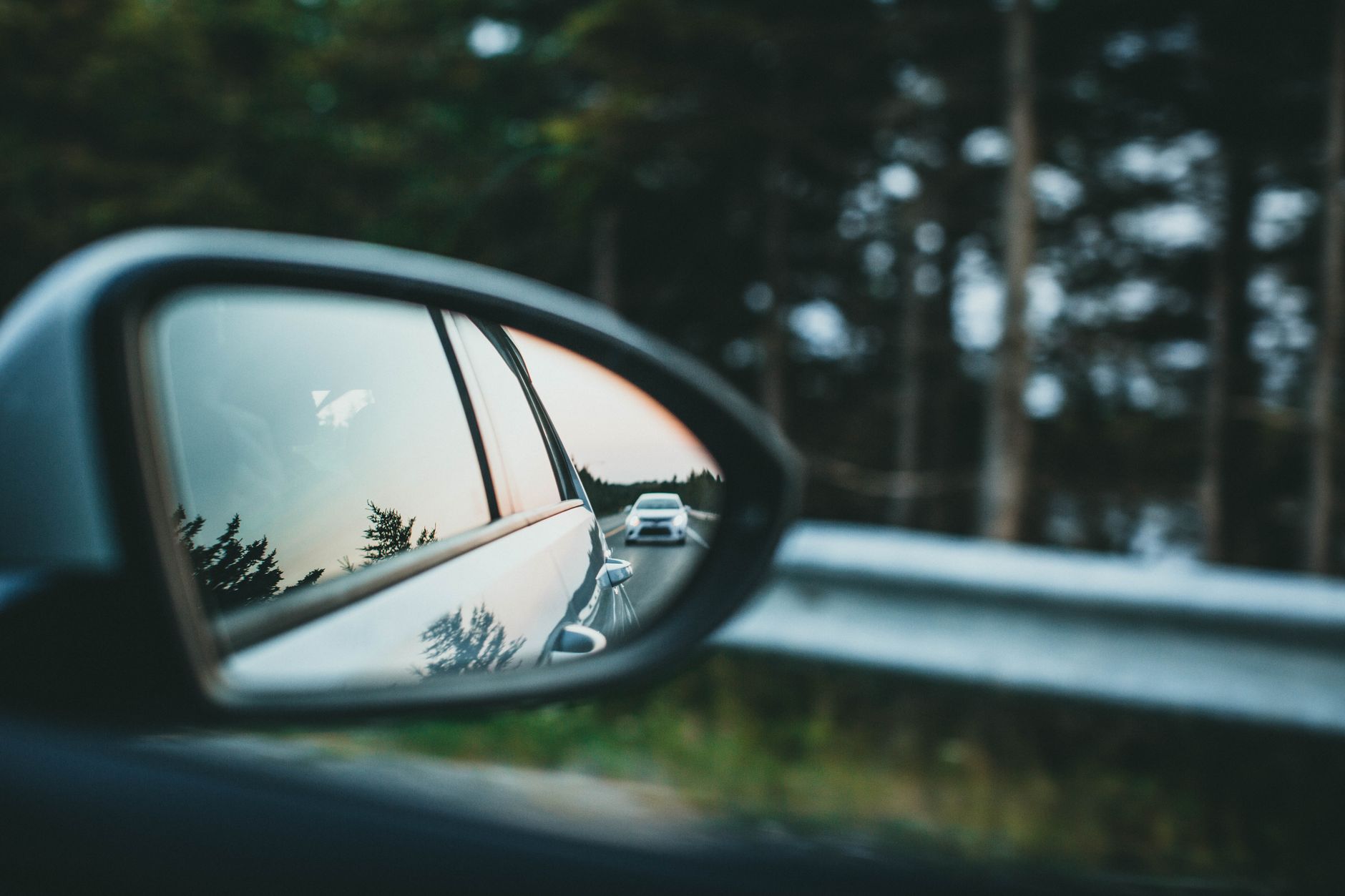Traffic reflected in a side mirror