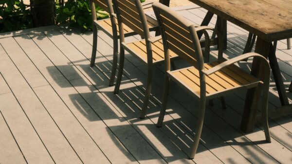 Best deck box: wooden chairs and a table on a backyard deck