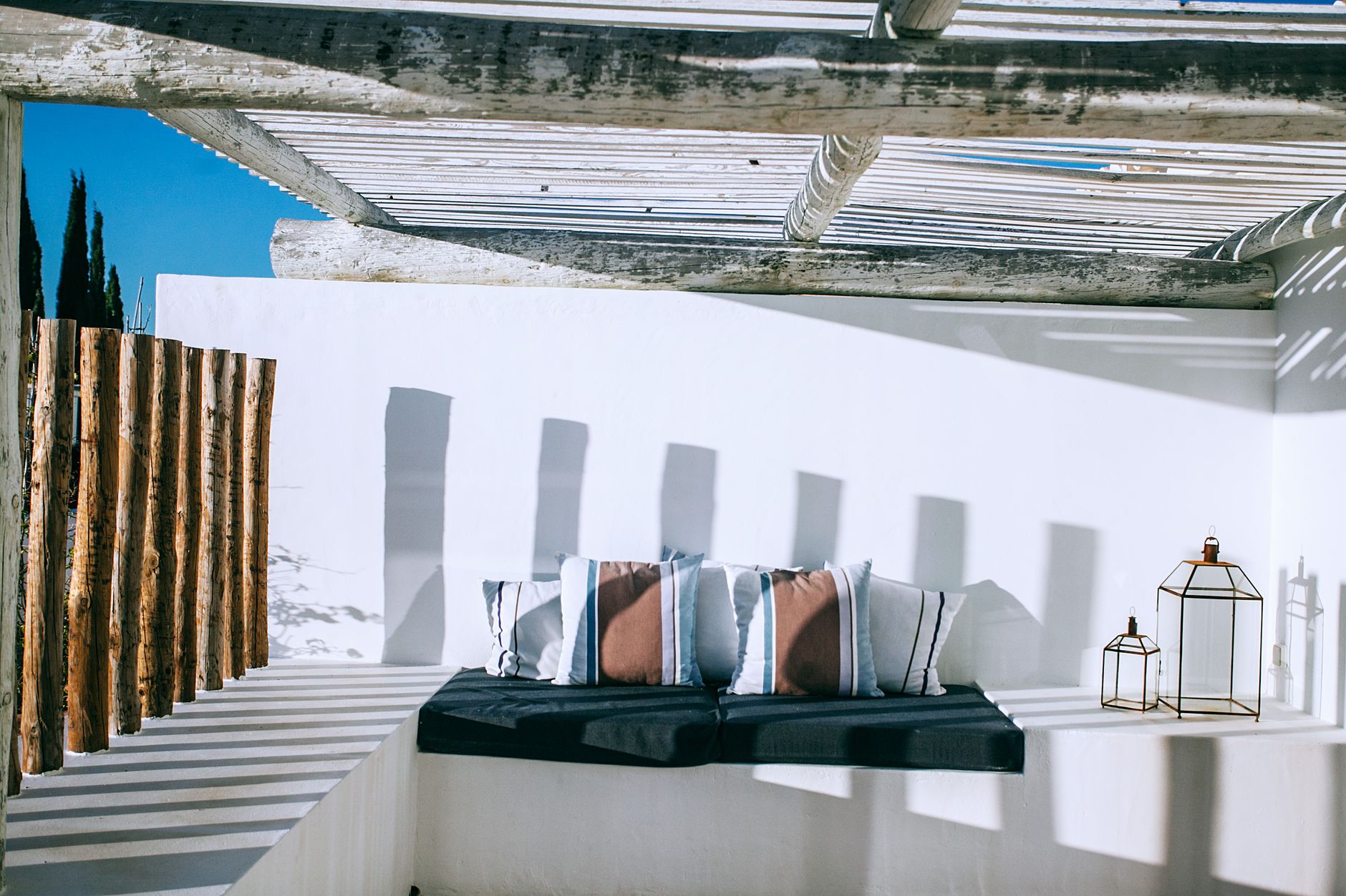 Cushions on built-in seating on a sunny patio
