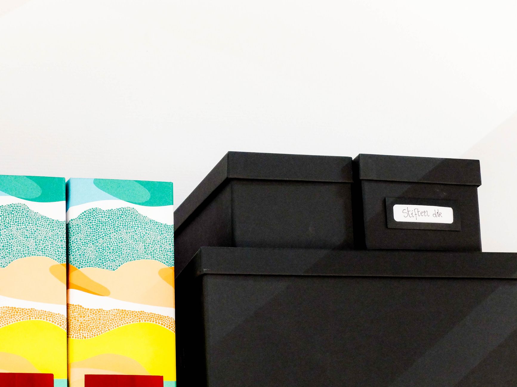 Storage boxes on a shelf