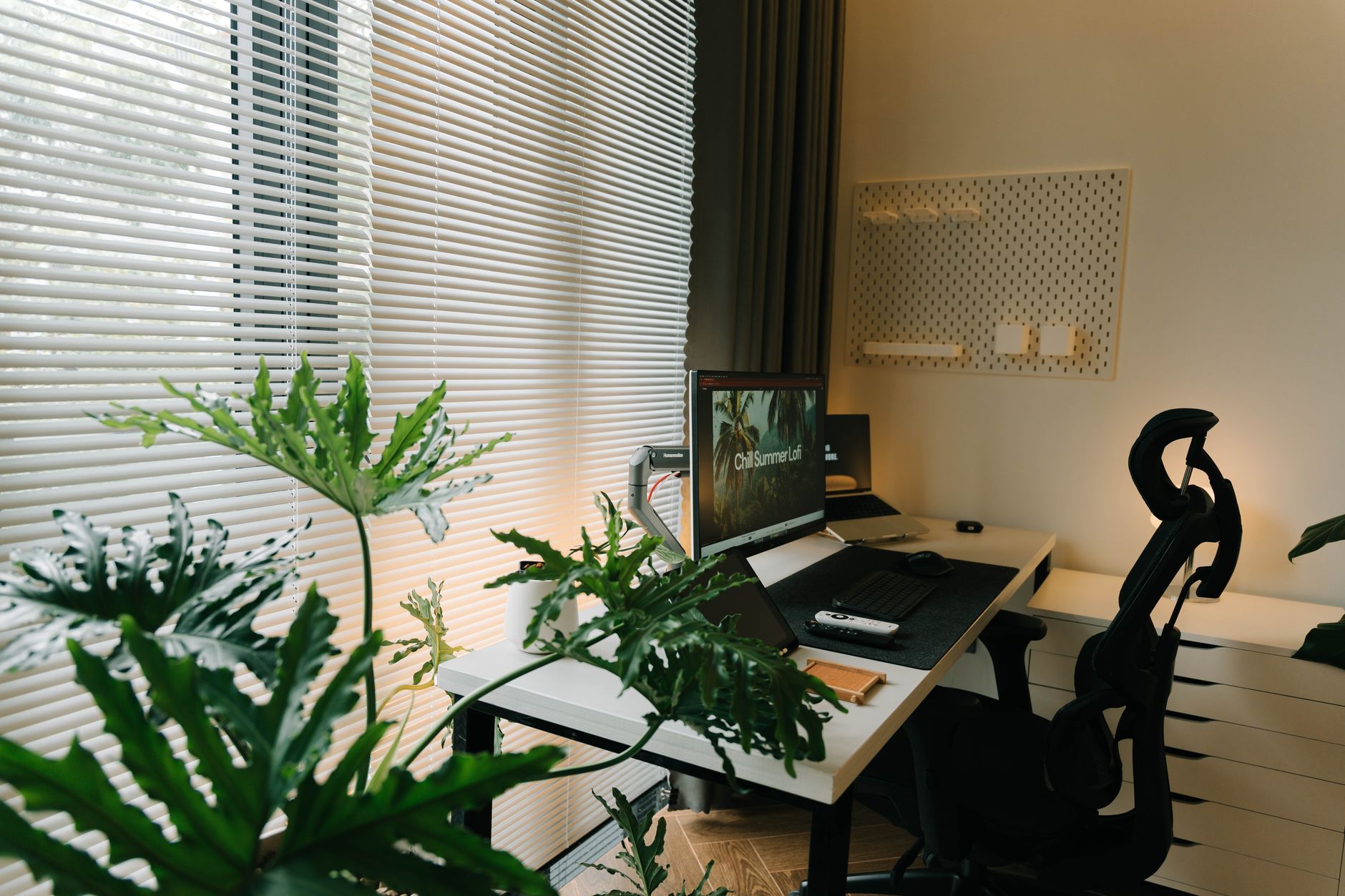 A small desk set up in a room at home