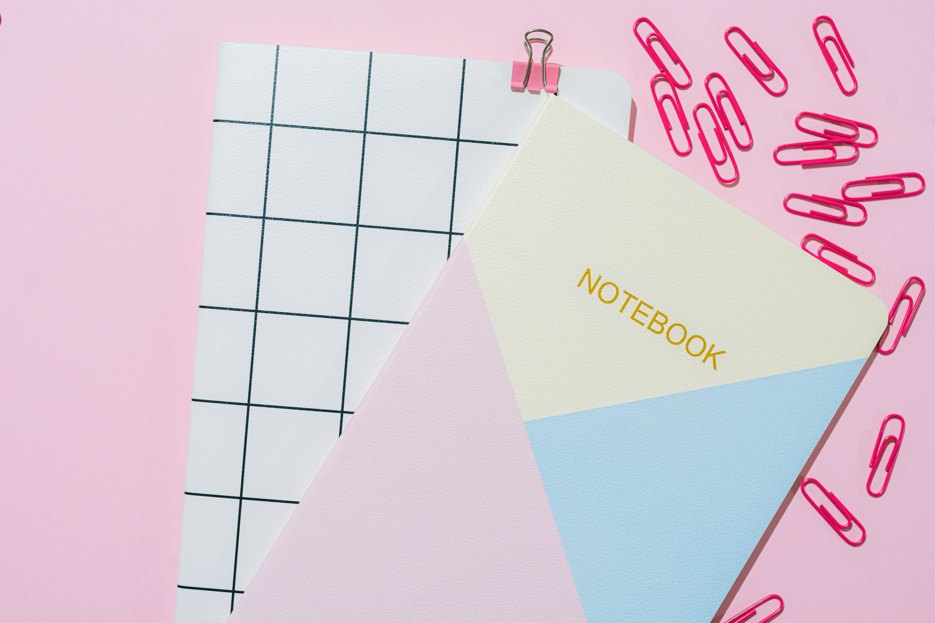 Notebooks and papers on a home desk