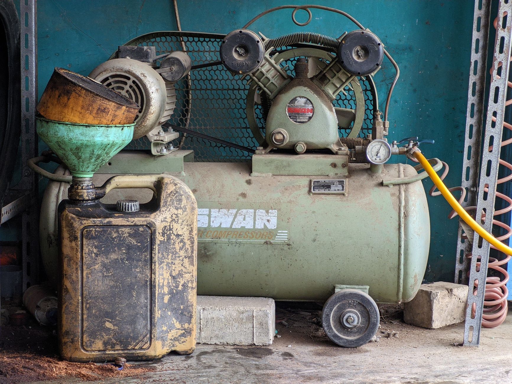 An air compressor in a garage