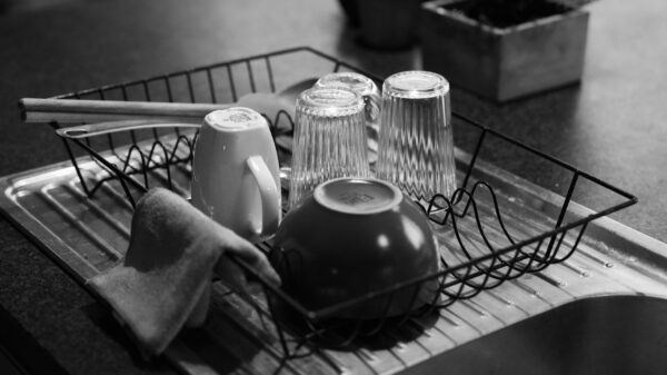 Glasses and mugs drying in a dish rack