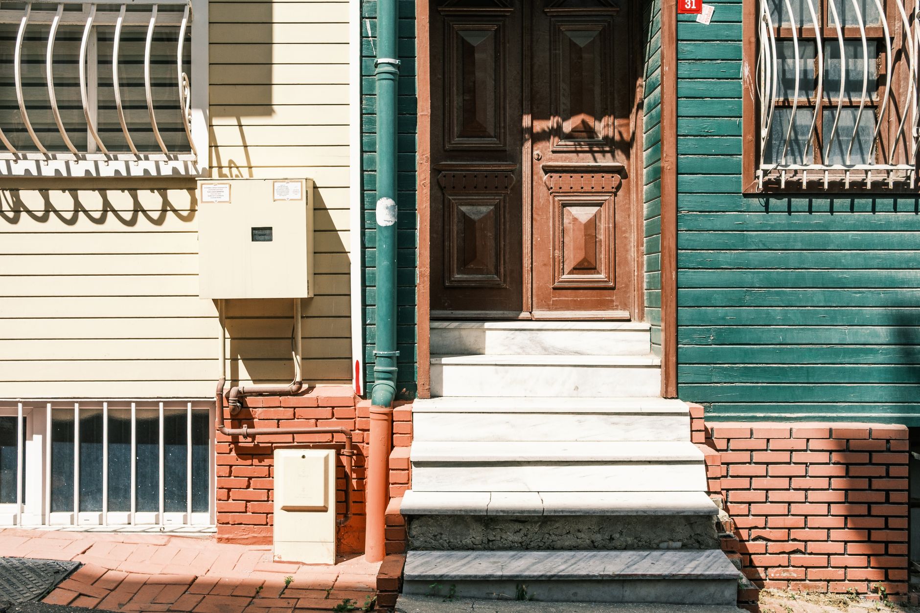 Front steps leading to a wooden door