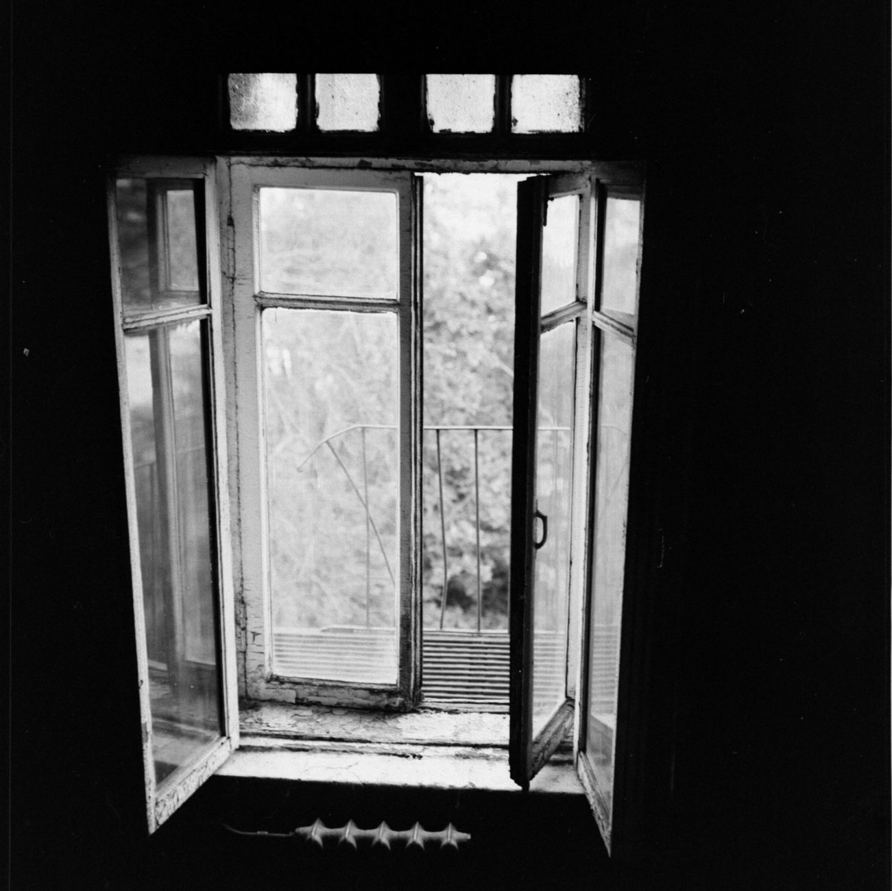 An open window letting fresh air into a room