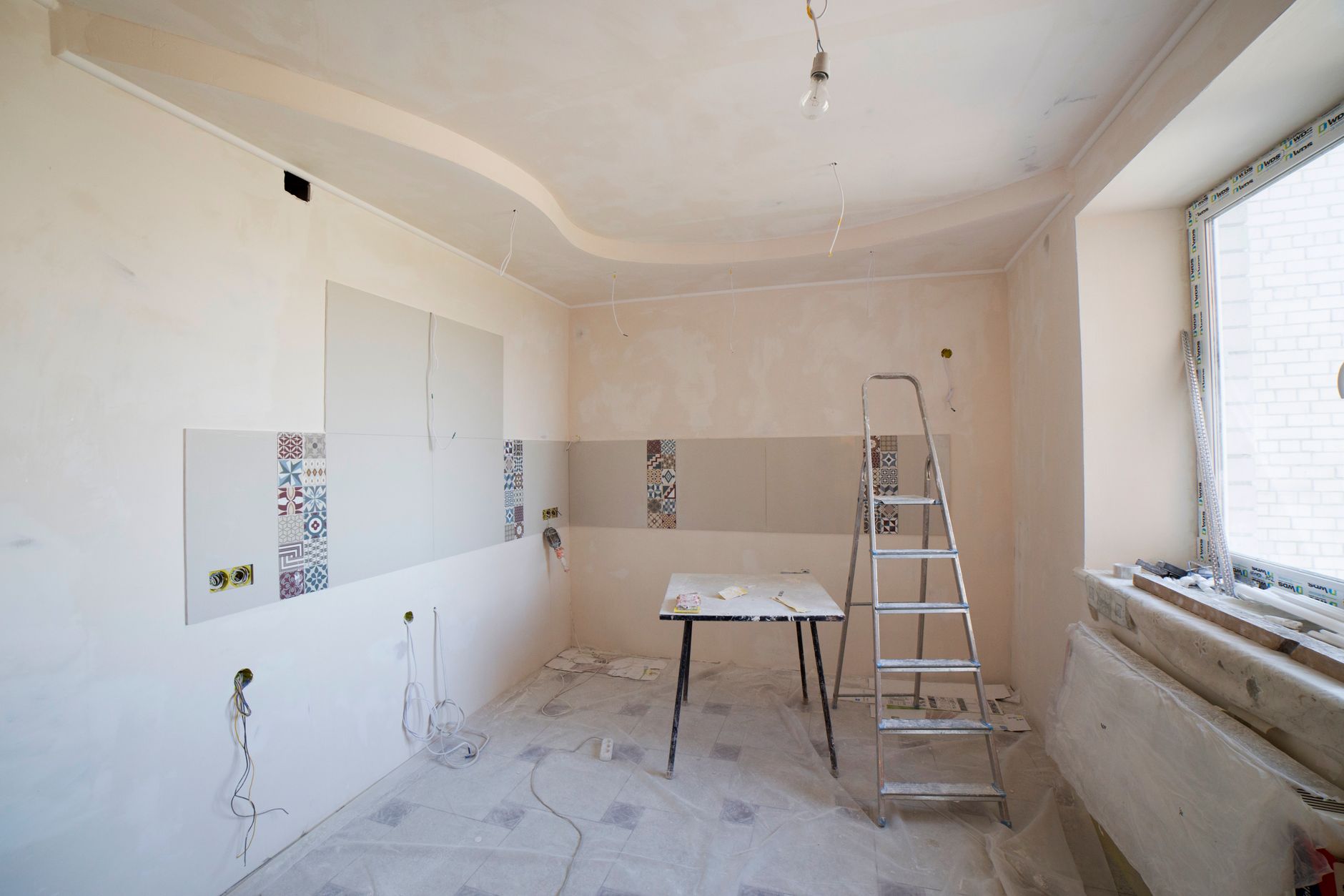 Best drywall sander: a room being renovated with new drywall