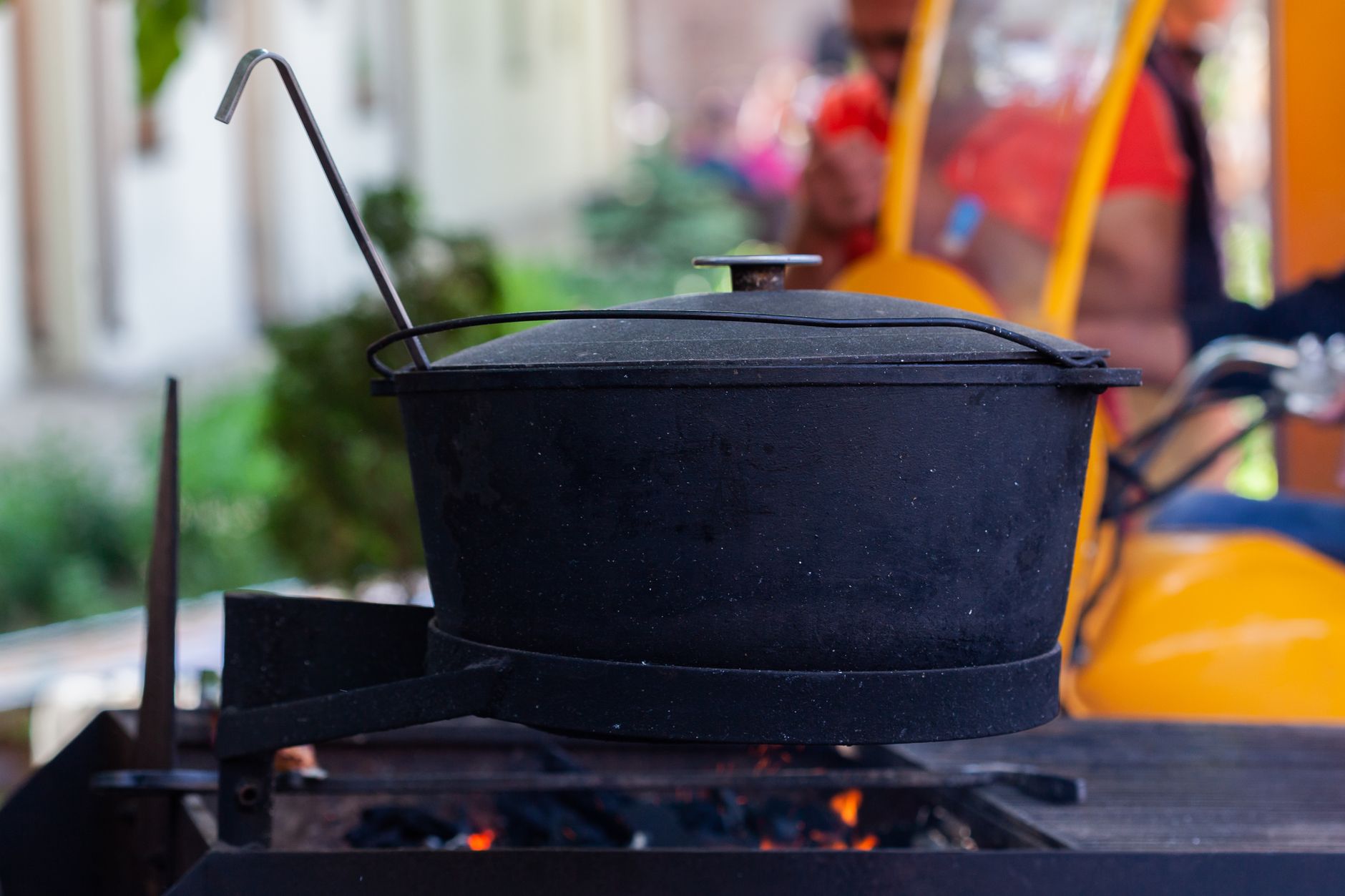 Cast iron pot over outdoor coals