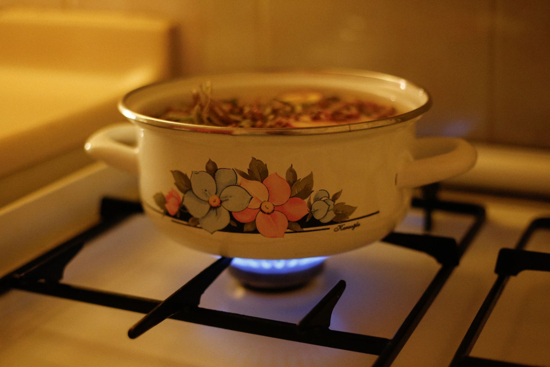 A pot of soup simmering on a stove