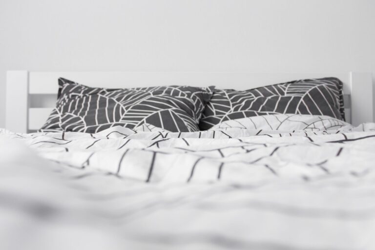 Best duvet insert: a made bed with a fluffy white duvet