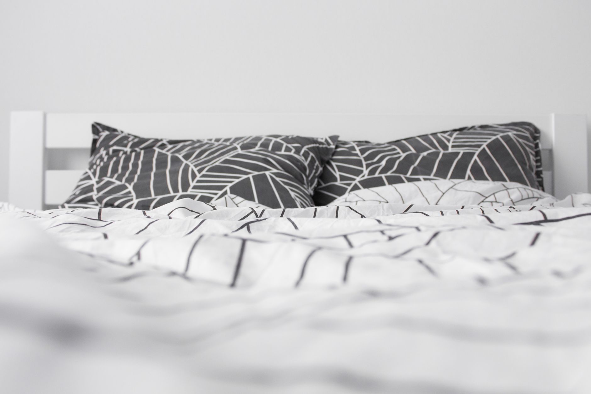 Best duvet insert: a made bed with a fluffy white duvet
