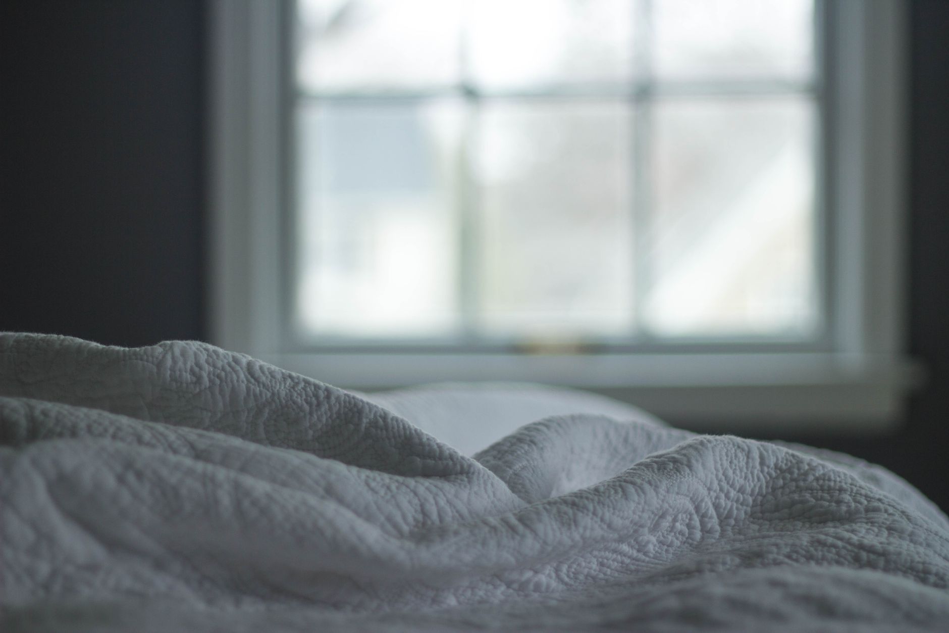 Close-up of quilted white bedding