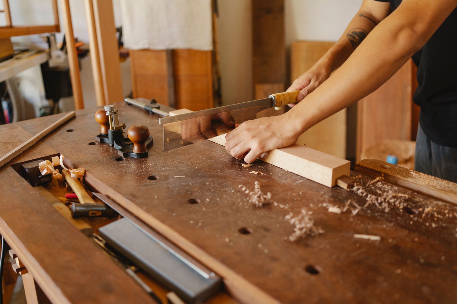 Planing a board on a woodworking bench