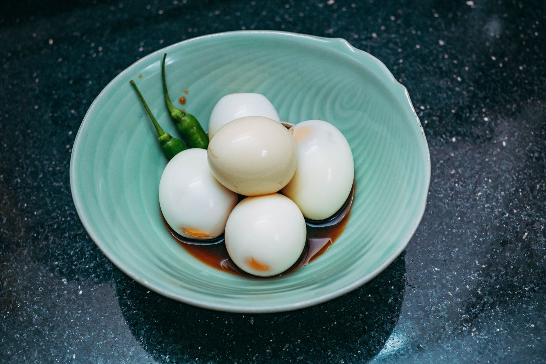 A bowl of peeled hard-boiled eggs