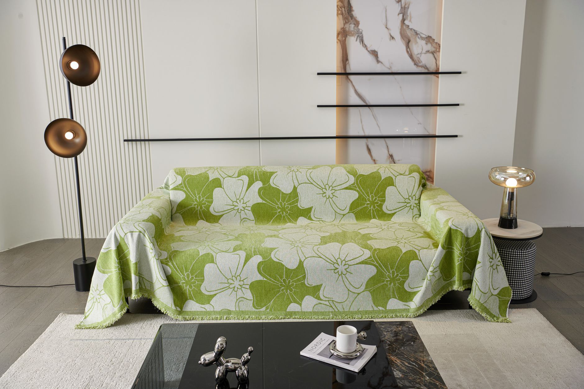 A sofa covered with a patterned throw