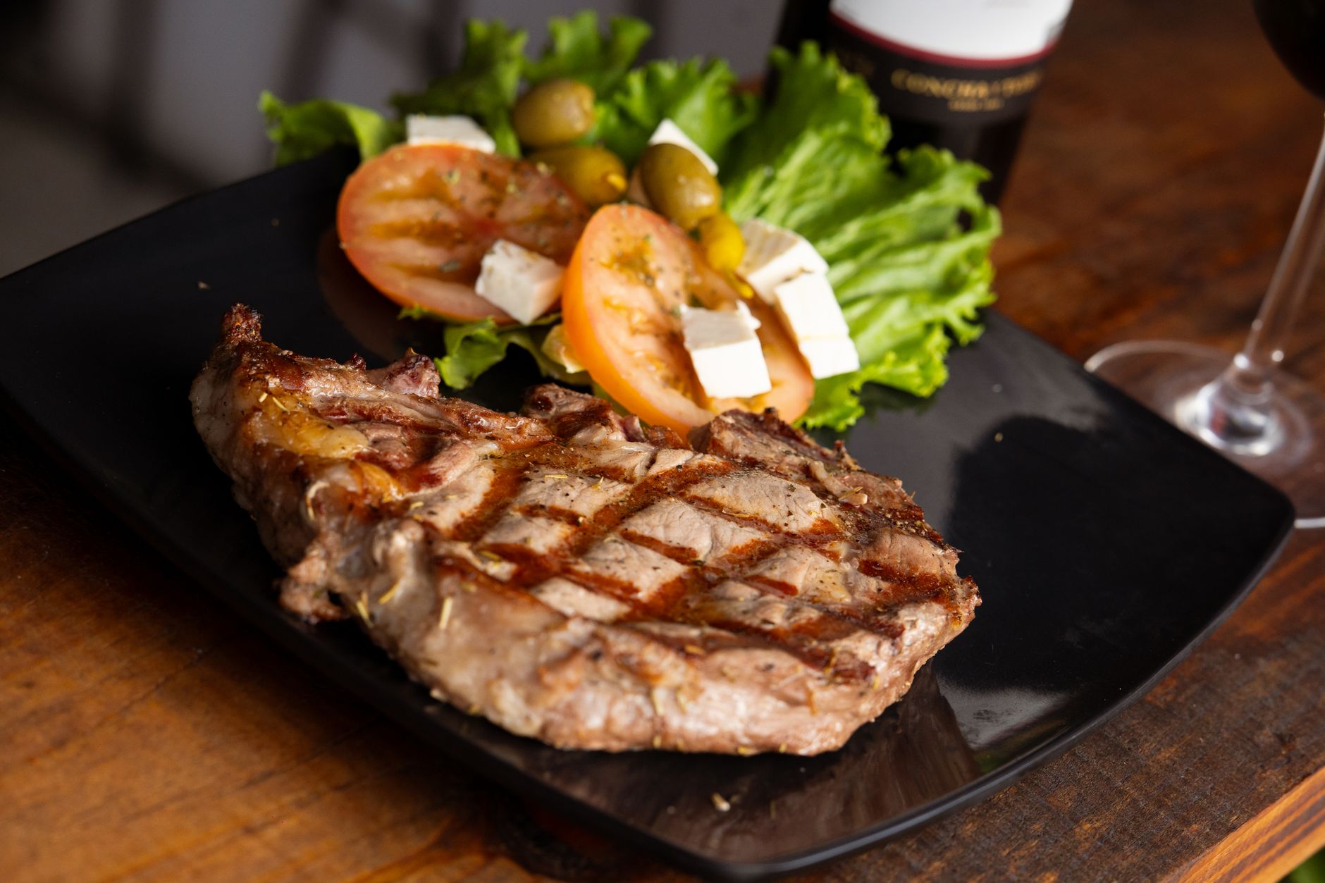 A grilled steak with salad