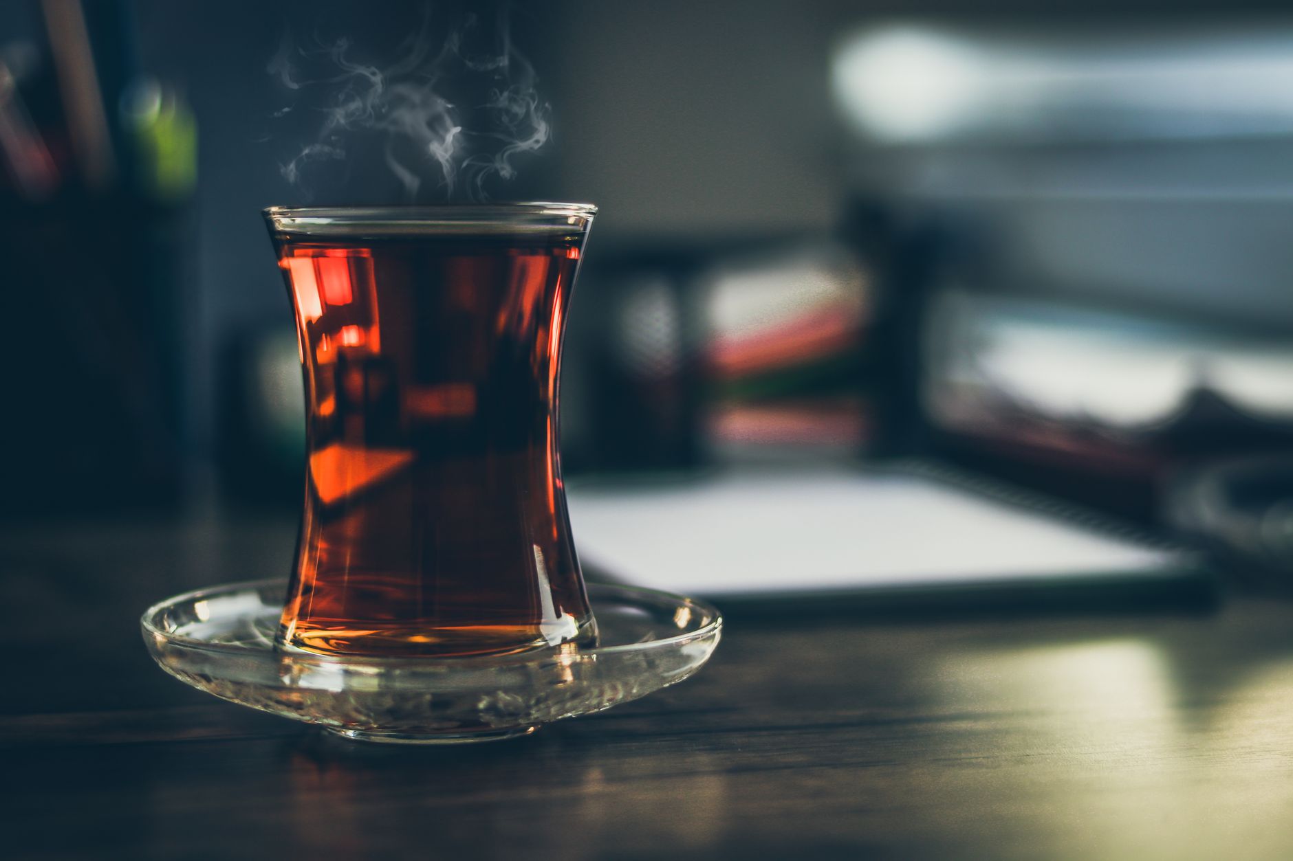 A steaming glass of tea