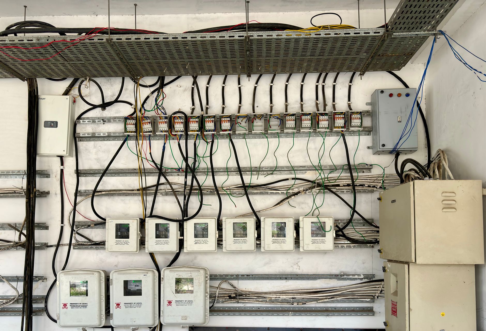 An electrical panel with meters and wiring