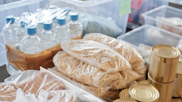 Bottled water, pasta and canned food stored in bins