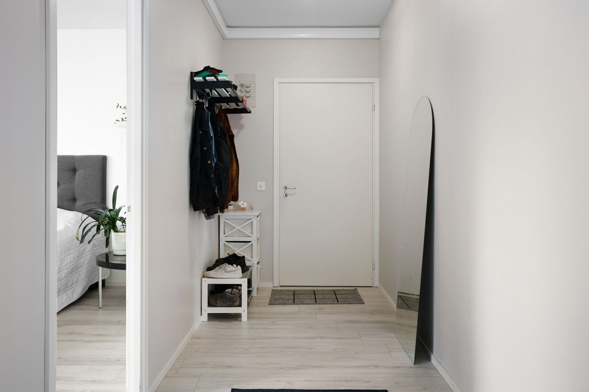 Best entryway bench: a bench with shoes stored beneath it near a front door
