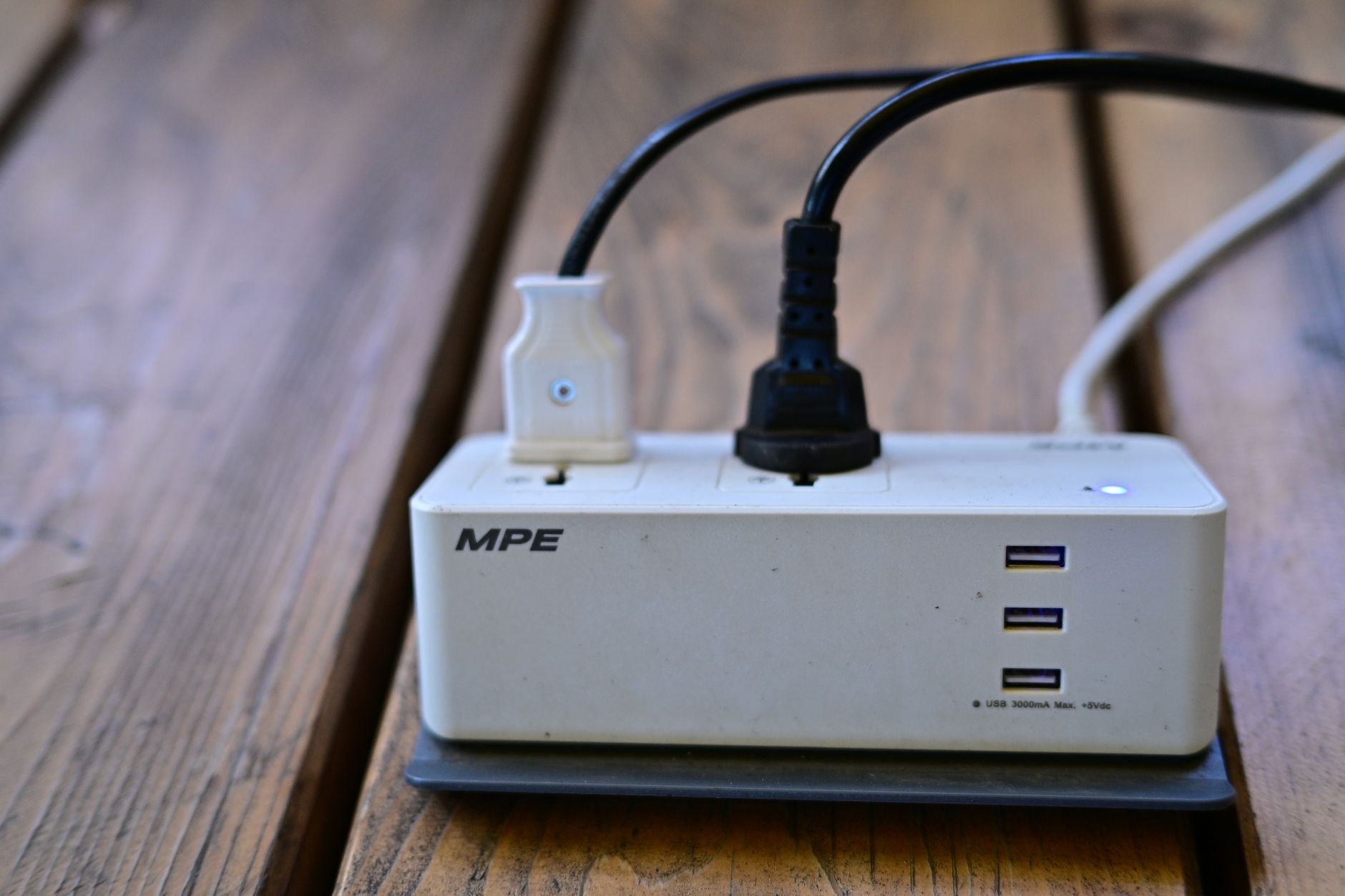 Best extension cord for freezer: plugs in a power strip on a deck