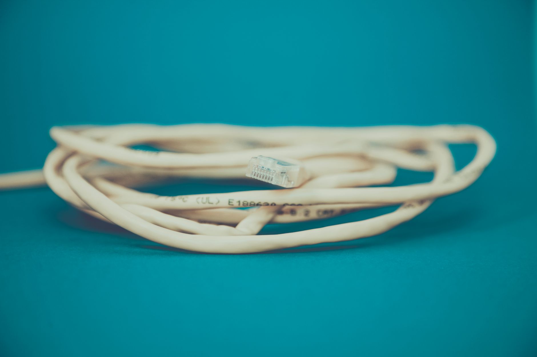 An extension cord coiled on the ground