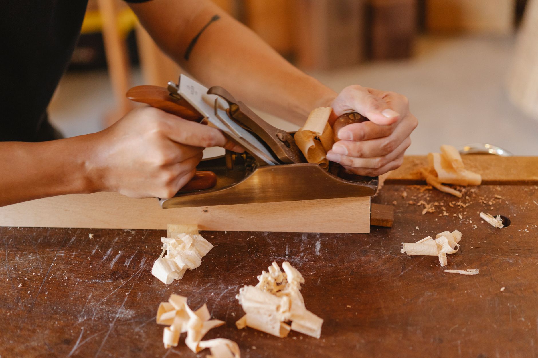 A home woodworking workshop with tools on the bench