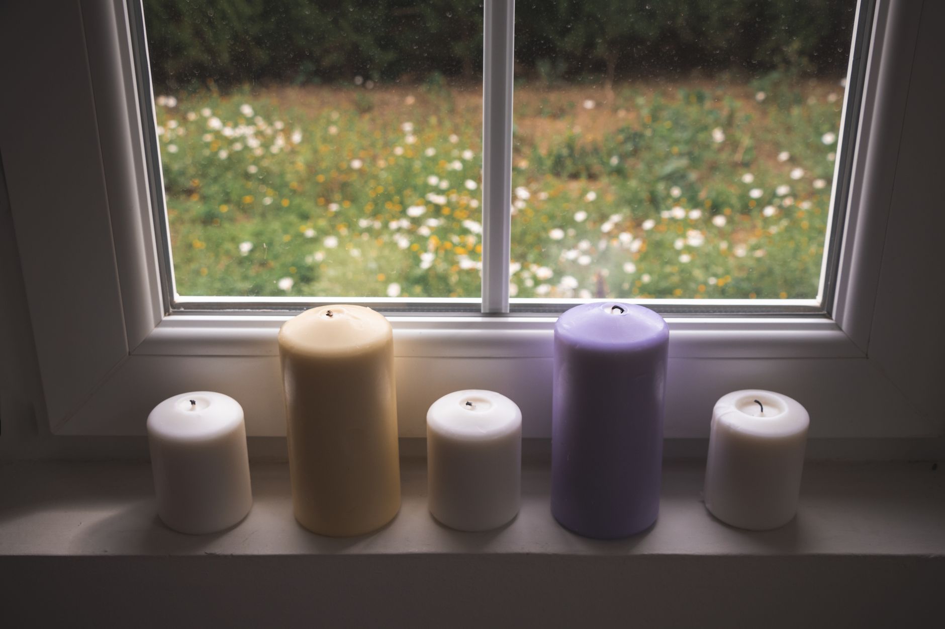 Pillar candles on a windowsill