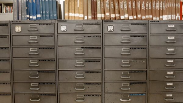 Best file cabinet: rows of metal filing drawers under bookshelves