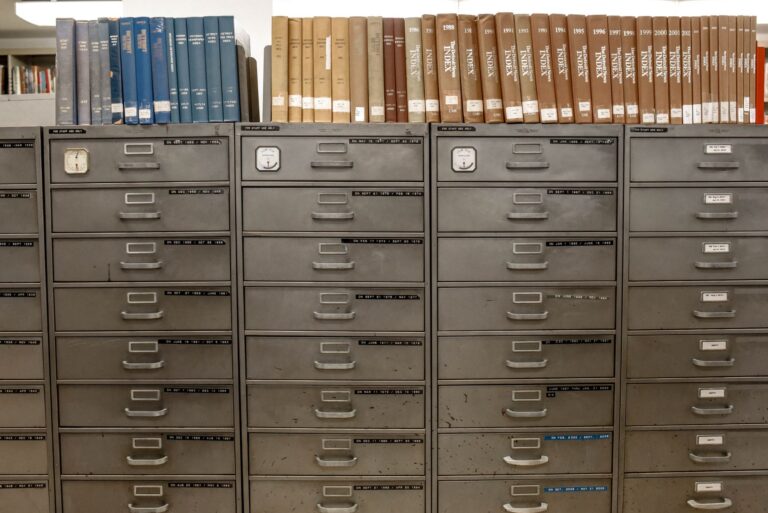 Best file cabinet: rows of metal filing drawers under bookshelves