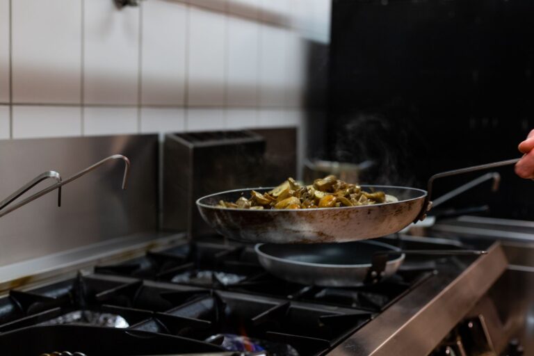 Best fire blanket for kitchen: cooking in a pan on a gas range