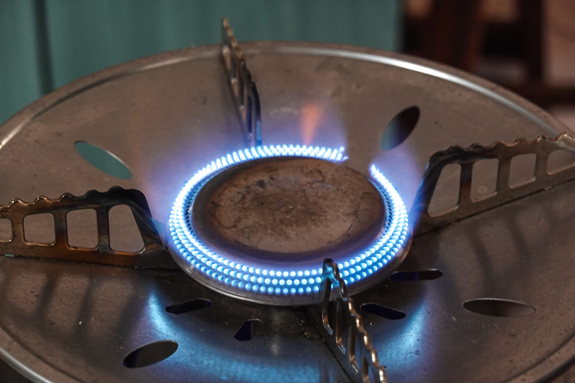 A blue gas flame on a burner