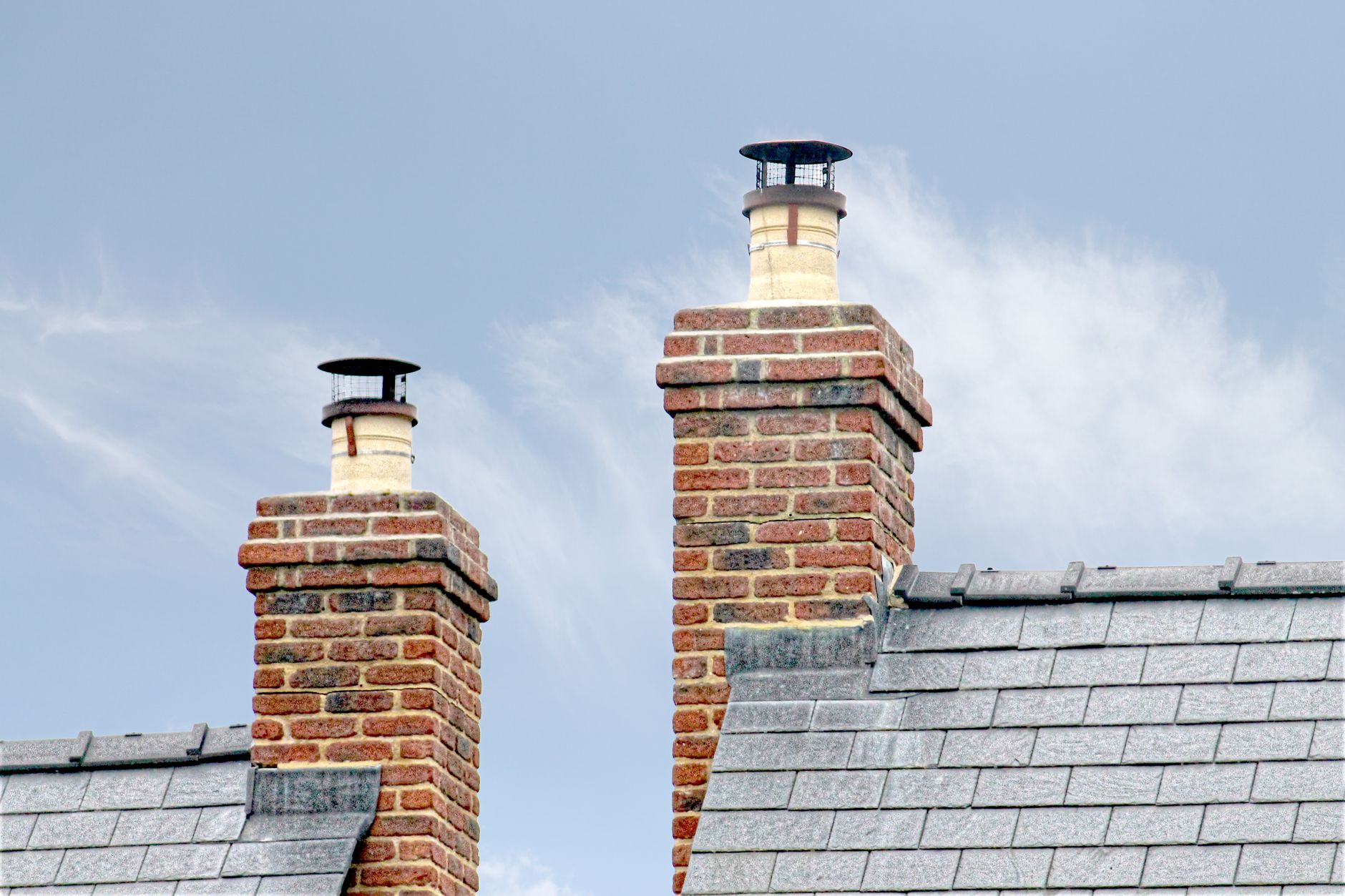 Brick chimneys on a slate roof