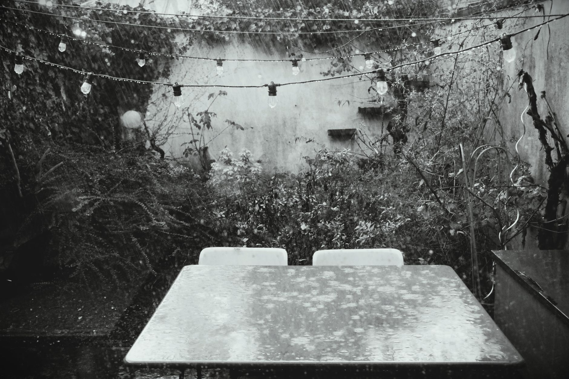 Rain falling on an outdoor patio