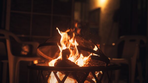 Best fire pit grill: a wood fire burning in a backyard fire pit