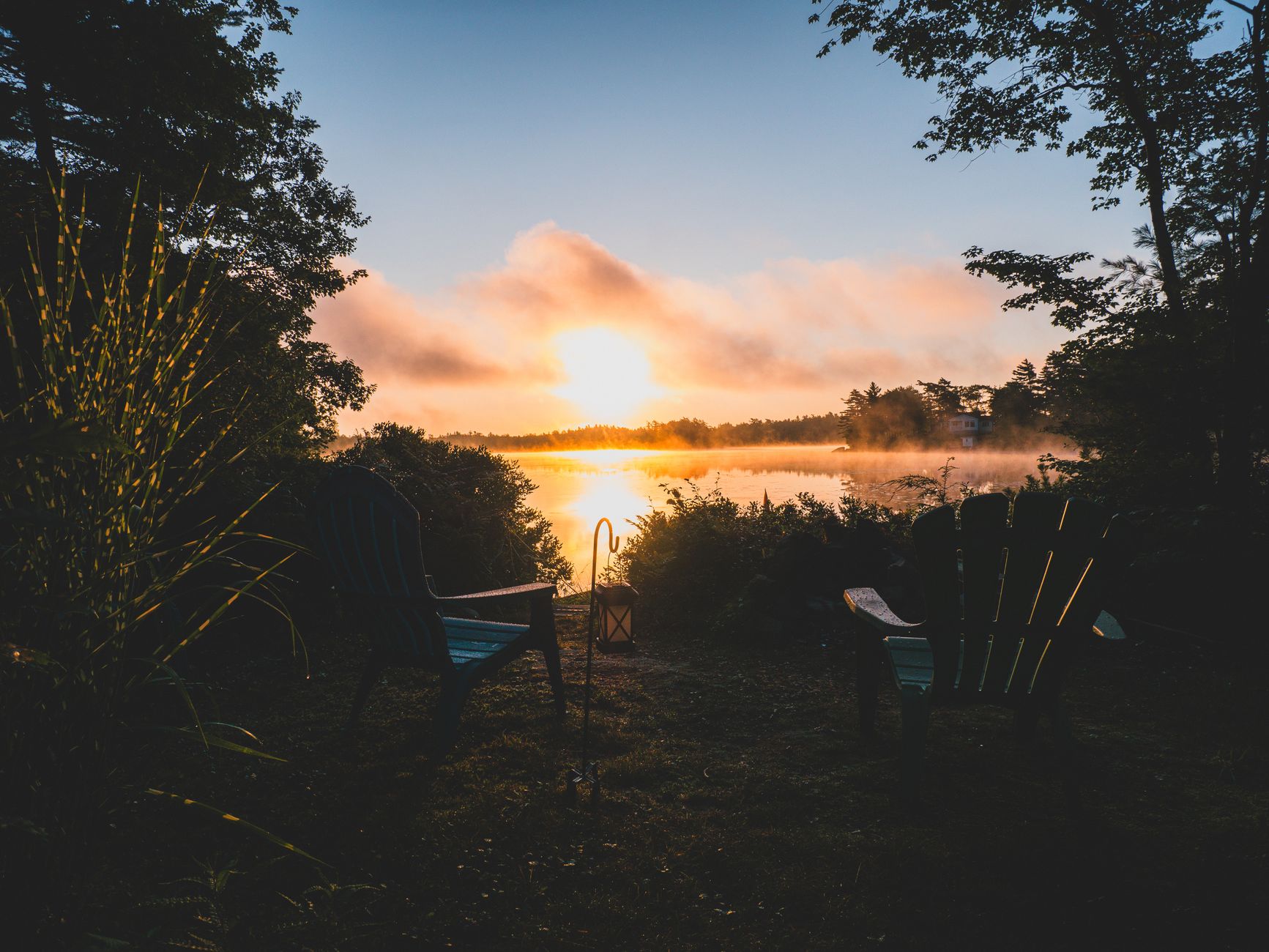 Outdoor chairs set out near the water