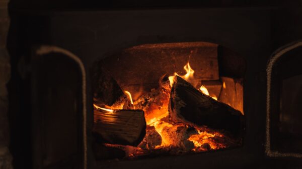 Best fireplace grate: logs burning in a home fireplace