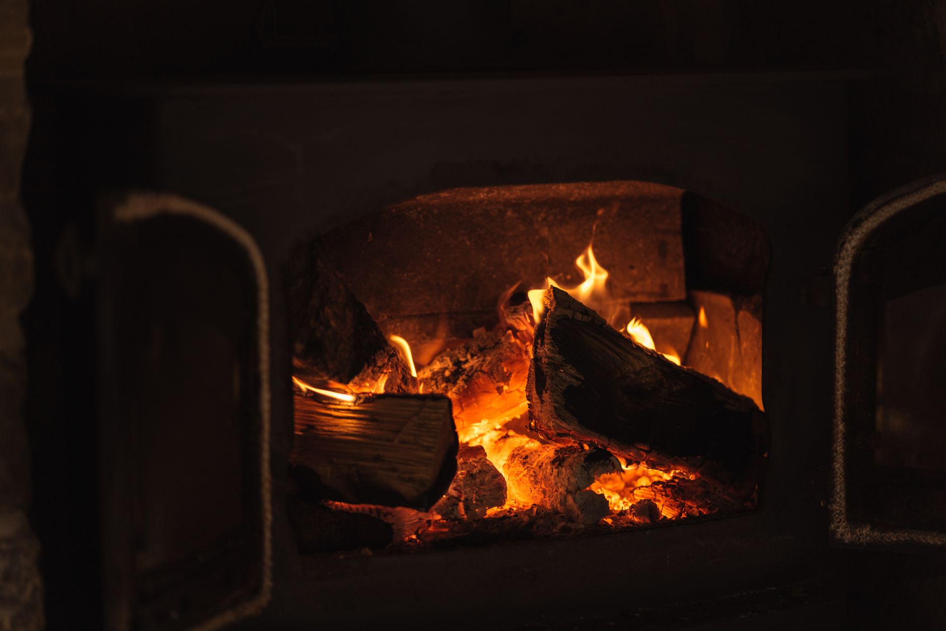 Best fireplace grate: logs burning in a home fireplace