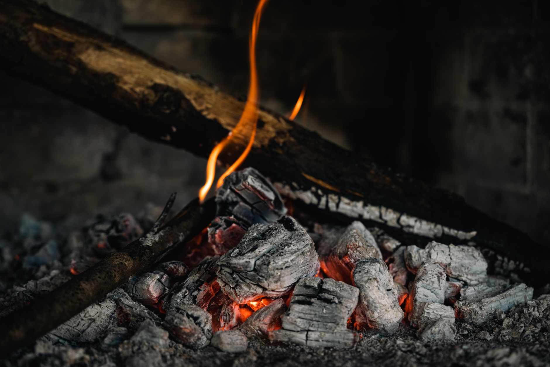 Glowing embers in a fireplace