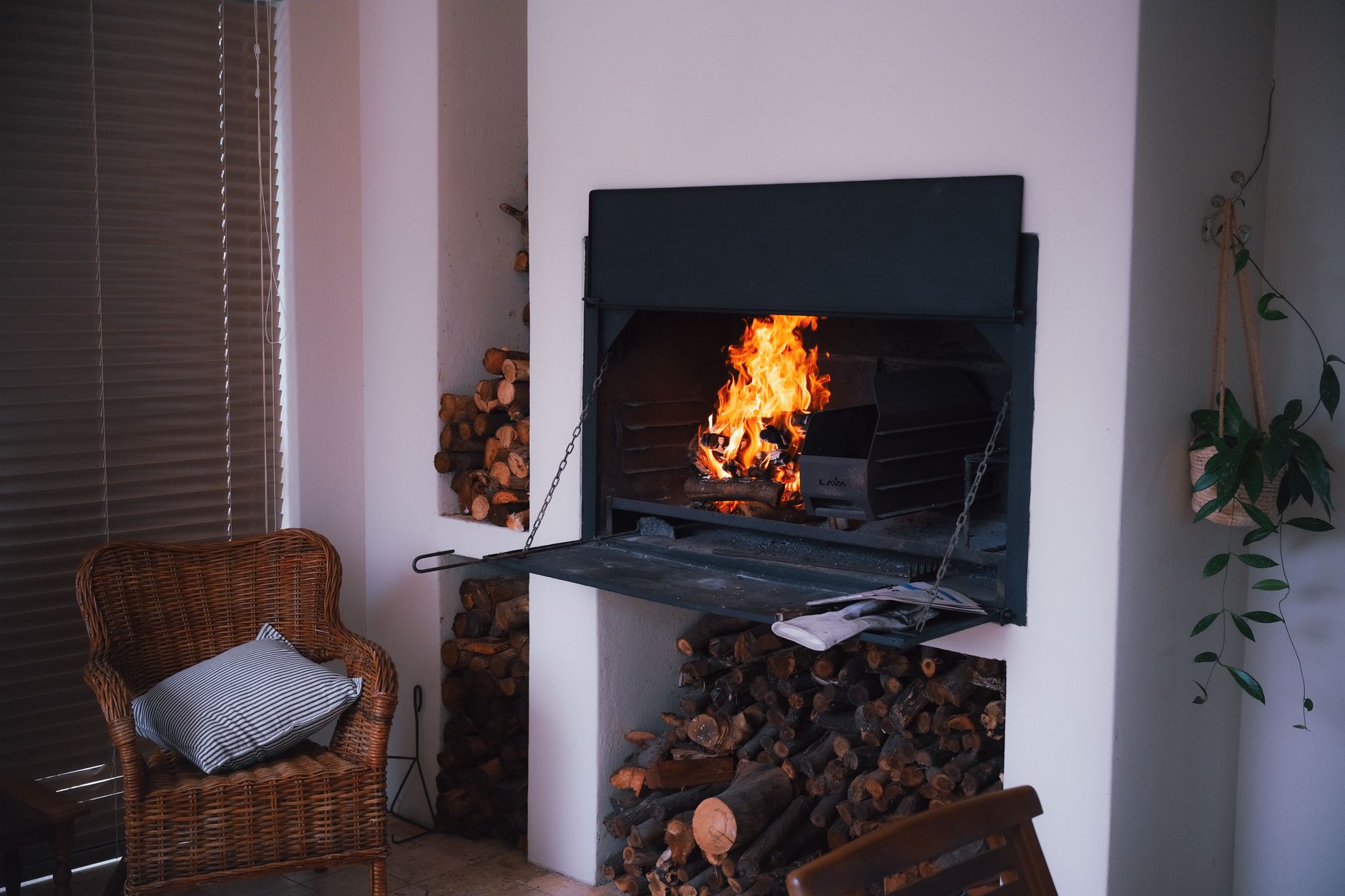 Best fireplace lighter: a fire in a fireplace with stacked wood