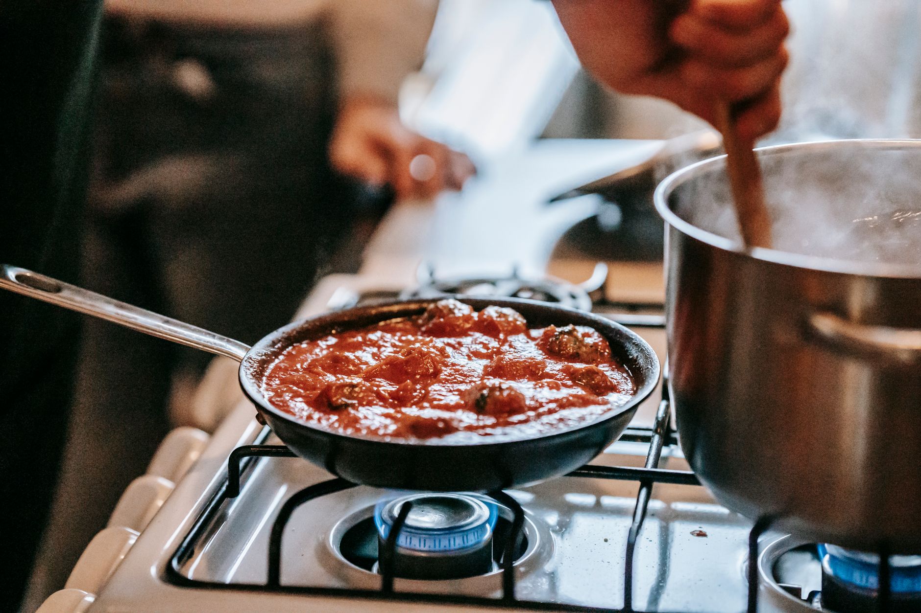 Cooking sauce on a gas stove