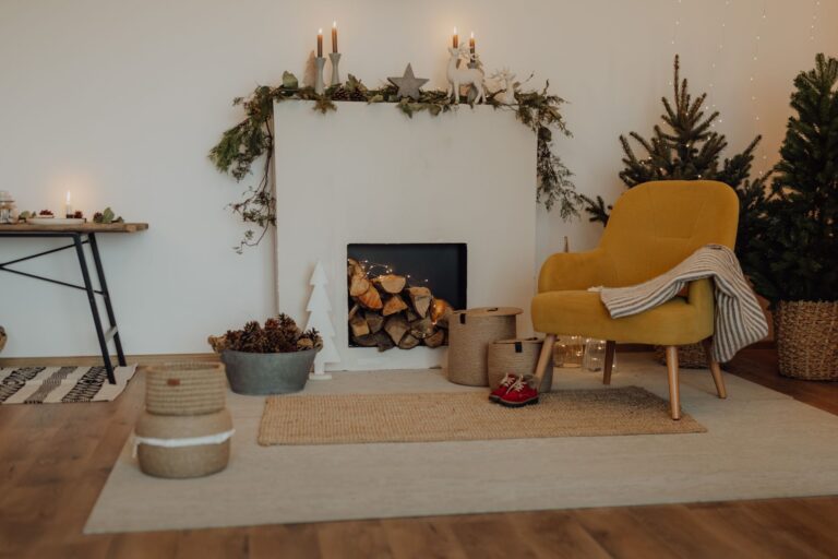 Best flameless candles: candles glowing on a mantel in a cozy living room