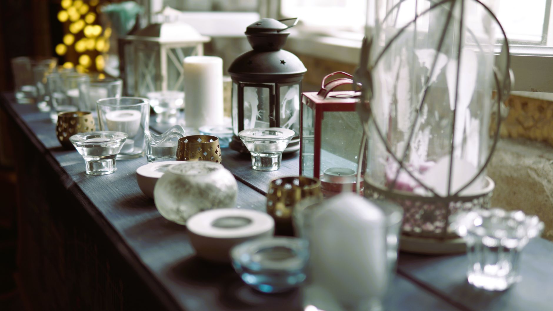 Lanterns and candles on a windowsill