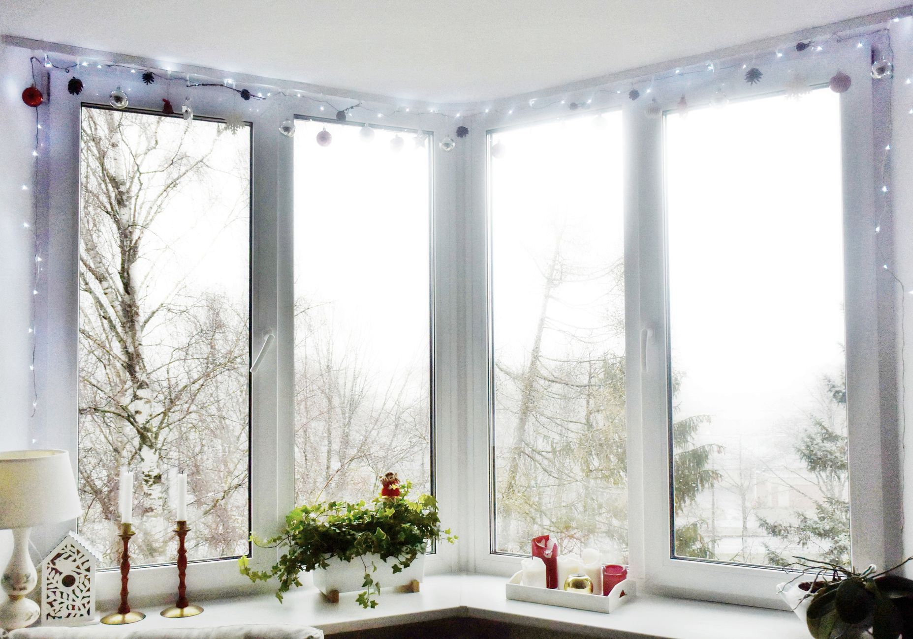 Candles on a windowsill in winter