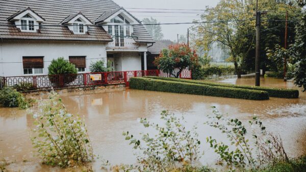 Floodwater surrounding a house and front yard