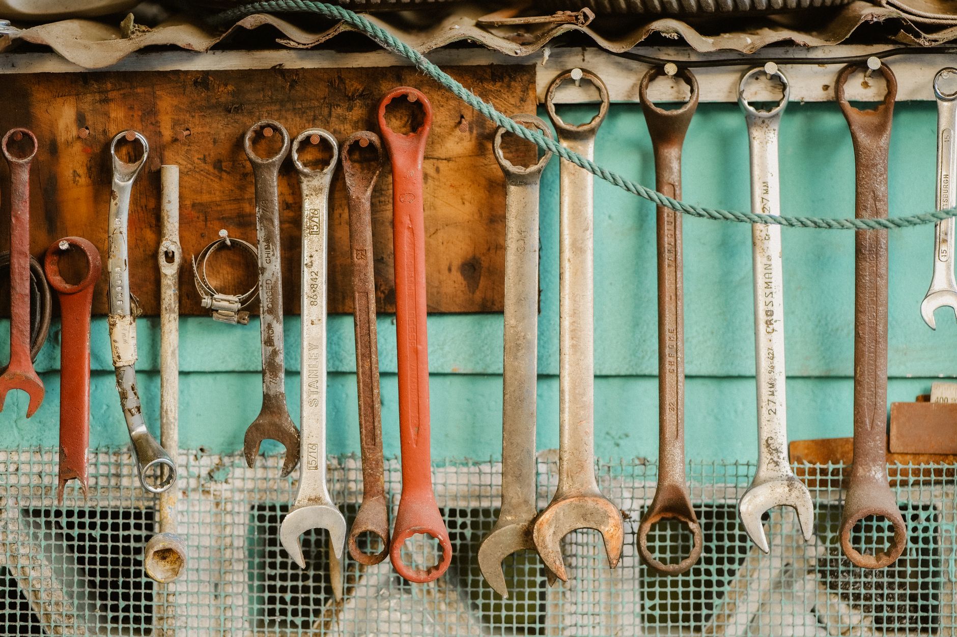 Wrenches hanging on a workshop wall