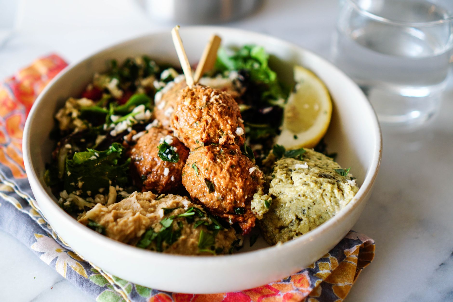 Bowl of falafel with greens