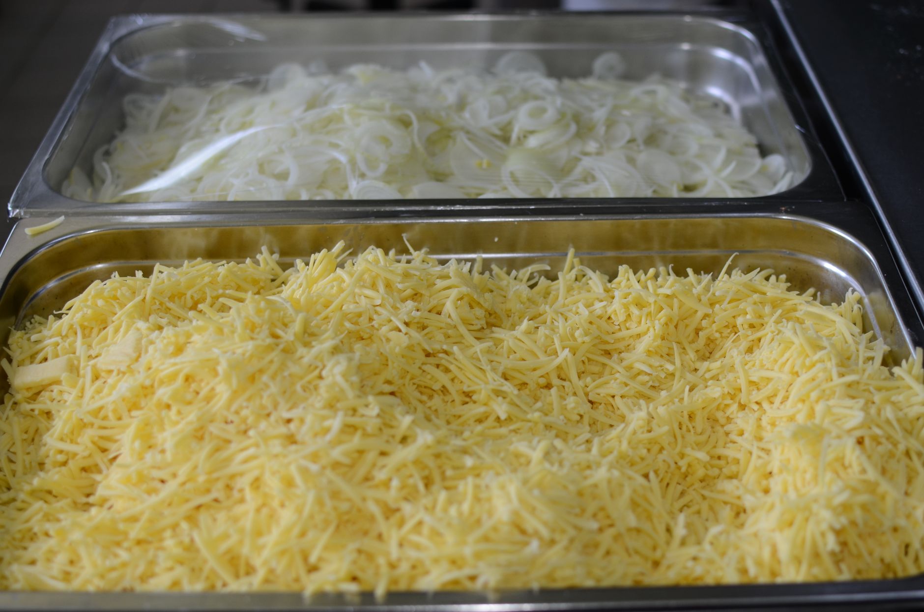 Shredded cheese in serving trays