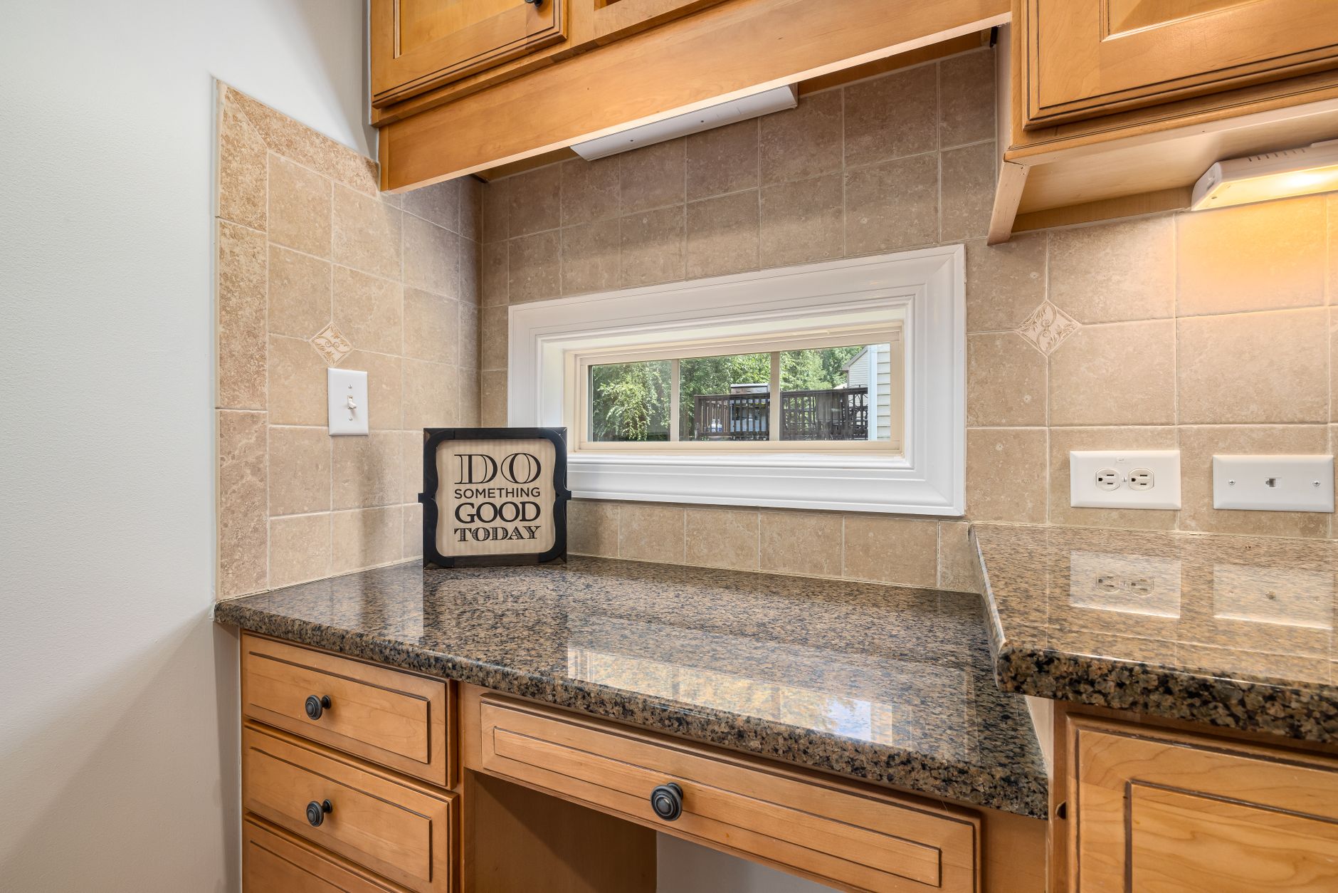 Kitchen counter beneath a window