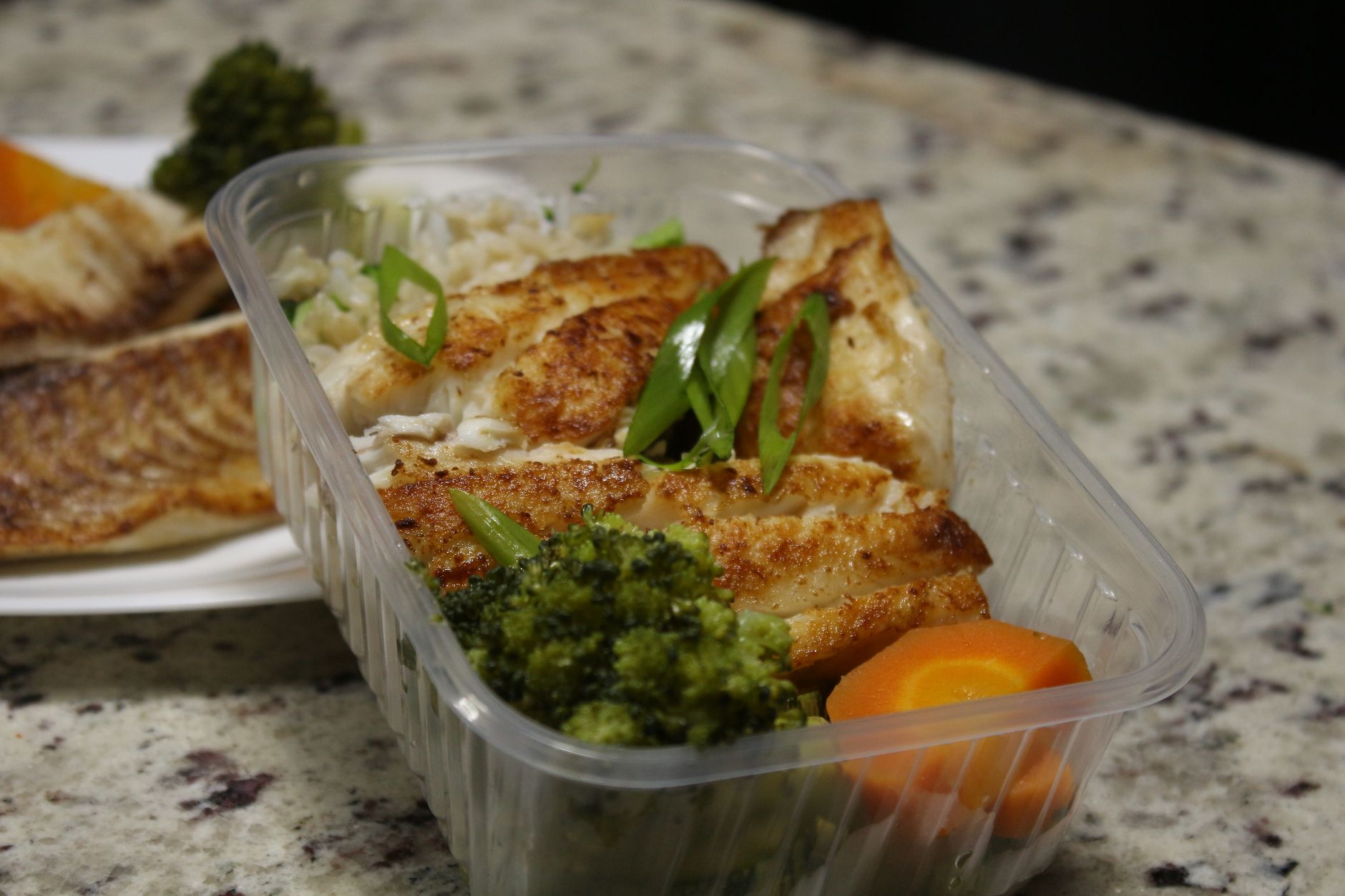 Fish and vegetables in a meal prep container